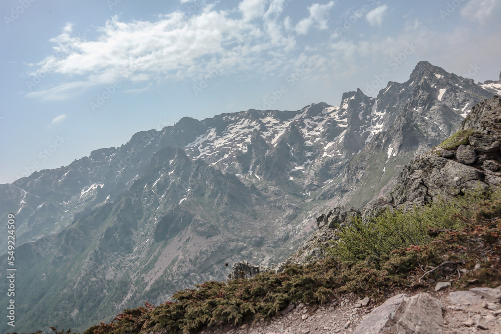 Mountains with snow. Some beautiful views during the long distance hike GR20 in Corsica.