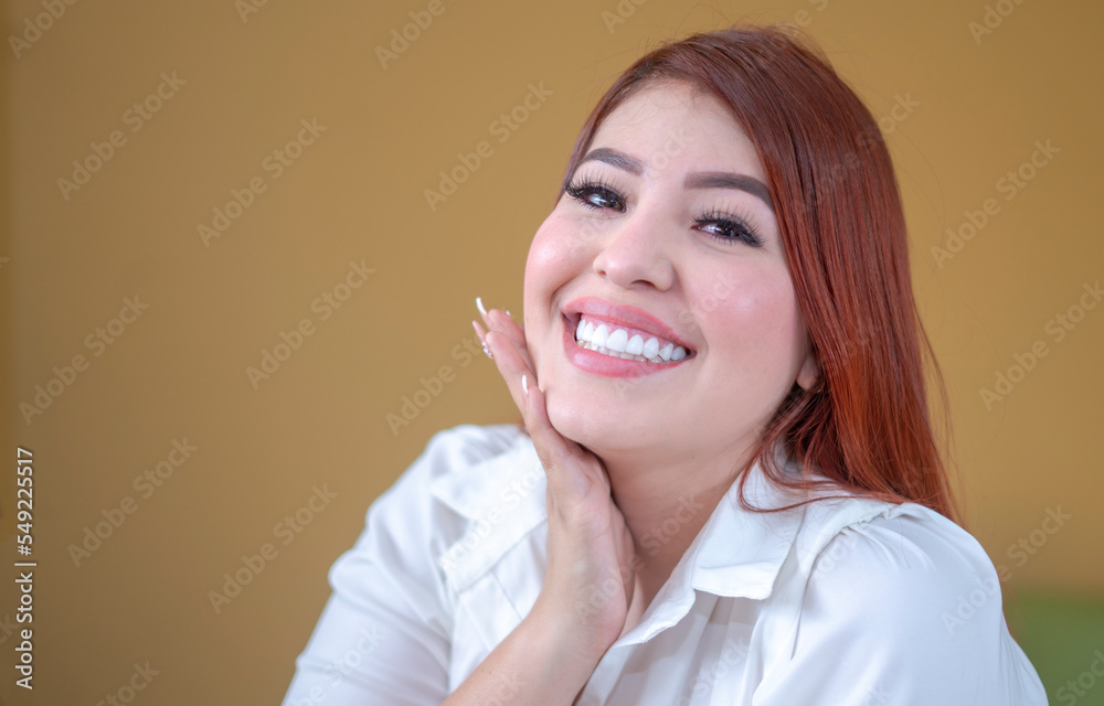 happy woman, enjoying a mustard yellow background, a beautiful smile and a white shirt happy woman, enjoying a mustard yellow background, a beautiful smile and a white shirt
