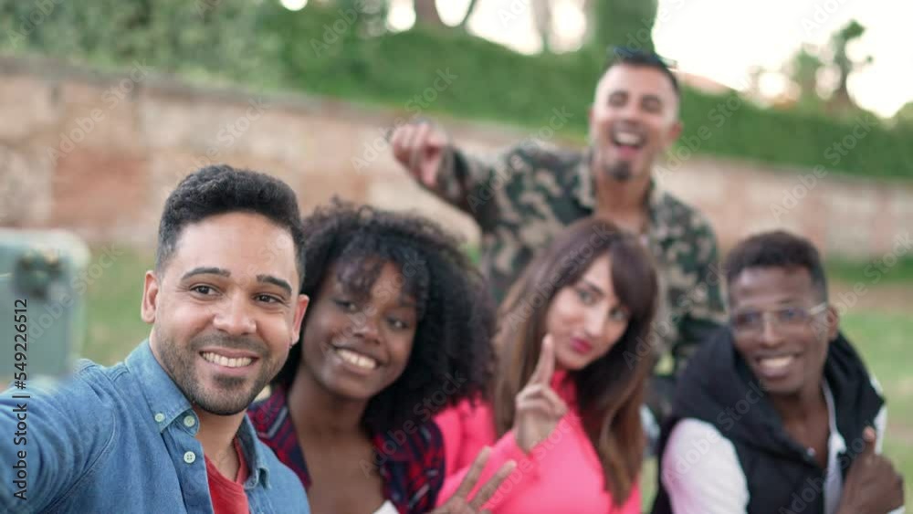 Group of friends taking a selfie with a mobile Group of friends taking a selfie with a mobile