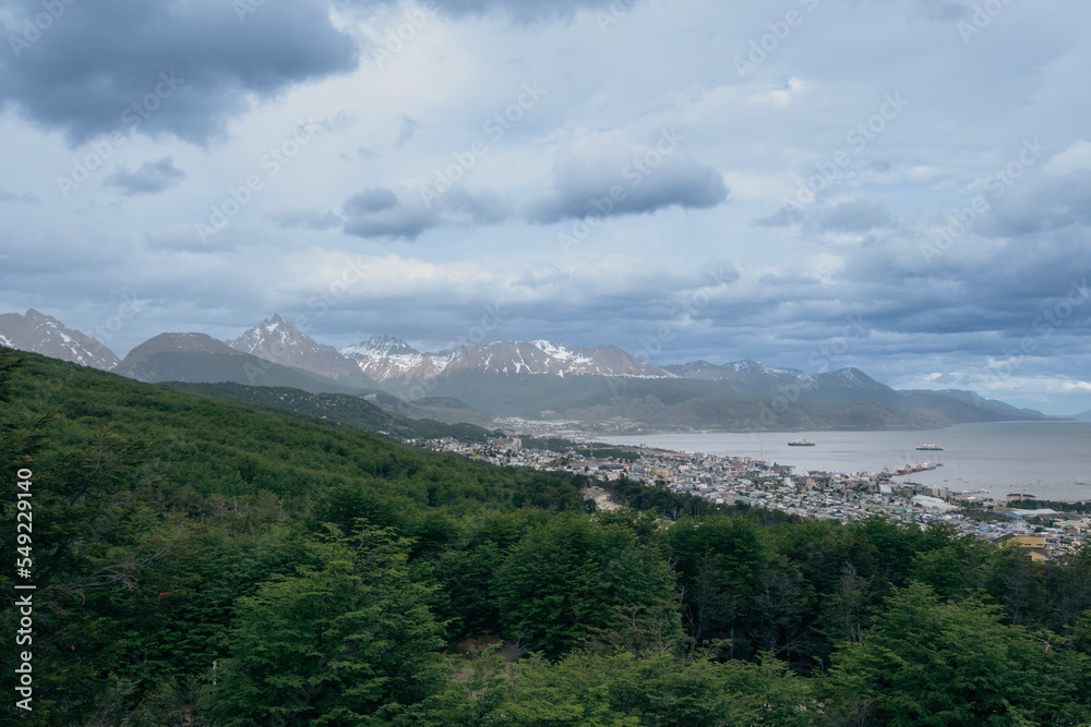 View of the Mountains surrounding the city of Ushuaia that flows into the harbor. 