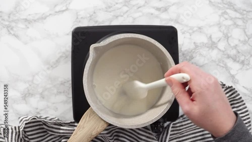 Flat lay. Step by step. Preparing tangzhong in a small saucepan to bake homemade bread. photo