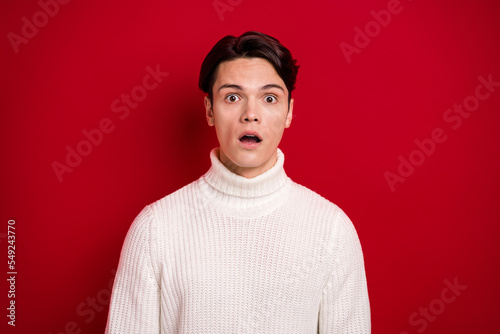 Closeup photo of reaction funny handsome guy wear warm comfort sweater open mouth unexpected desirable gift isolated on red color background
