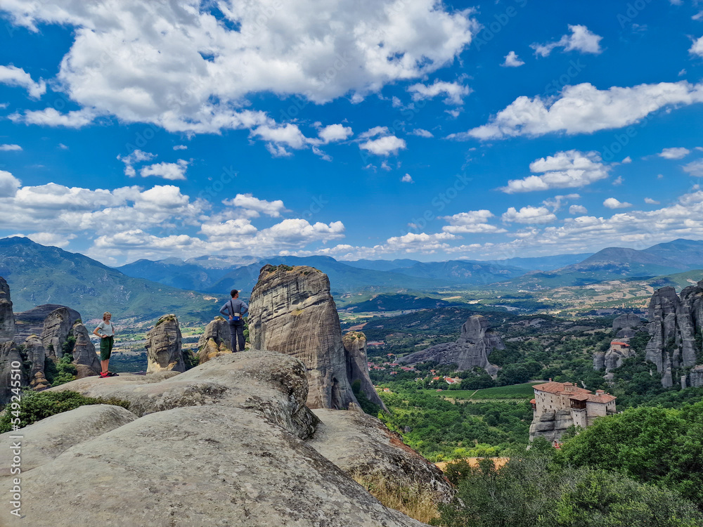 People enjoy the spectacular view of the Meteora rock formations hosting Orthodox Christian monasteries in Greece