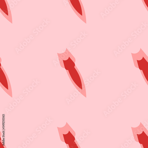 Seamless pattern of large isolated red falling rocket symbols. The elements are evenly spaced. Vector illustration on light red background