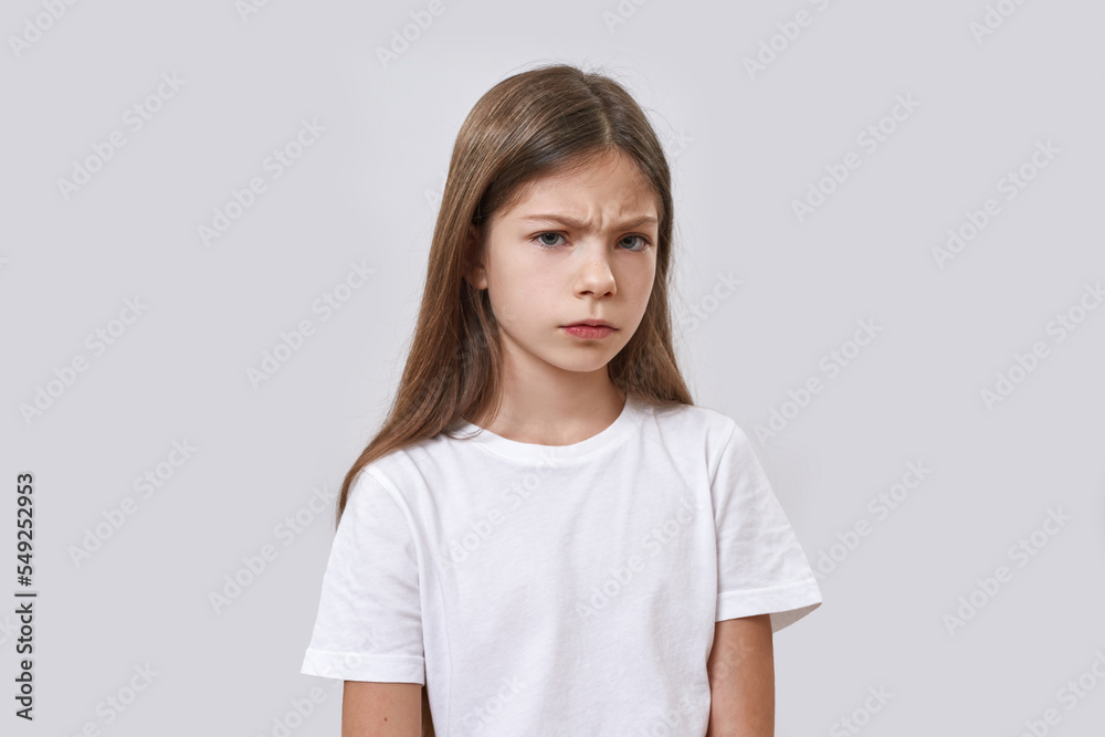 Little girl with skeptical face looking at camera Little girl with skeptical face looking at camera
