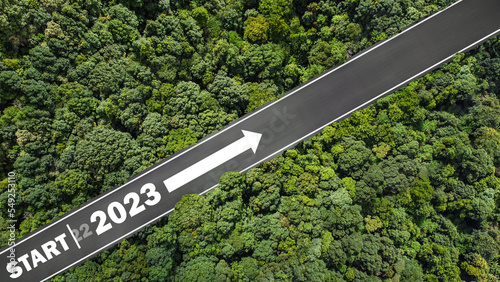new year 2023 numbers on road drag tires Planning concept, goals, challenges, environment in 2023, bird's eye view.