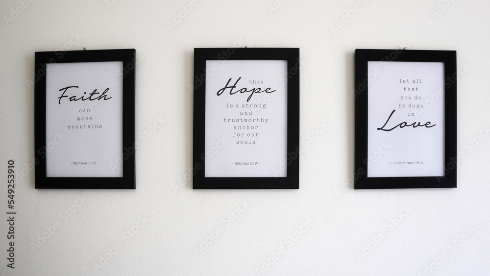Religious texts in photo frames on the wall about faith, hope and love and principles of life based on Bible verses. Religious texts in photo frames on the wall about faith, hope and love and principles of life based on Bible verses.