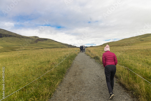 Hikers trekking up to Fjadrargljufur canyon in South Iceland to enjoy scenic and dramatic landscape