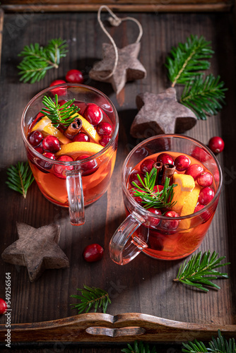 Aromatic Christmas punch with orange  cranberry and cinnamon 