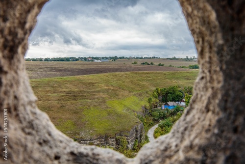 Stone window of a castle from the 14th century in Kamianets-Podilskyi photo