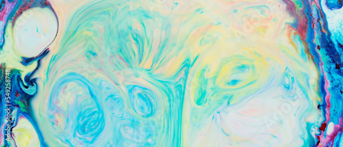 Fluid Art. Multicolored abstract background on the liquid. Trendy backdrop