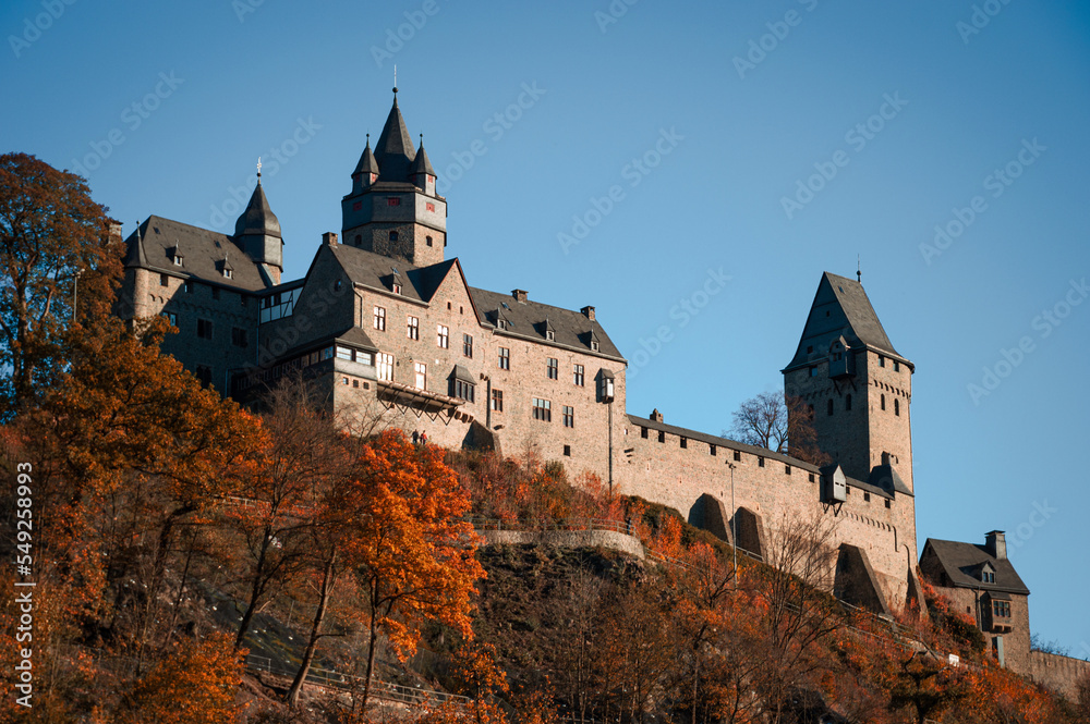 Altena Castle “Burg Altena“ in Sauerland Germany is a famous Landmark monument in the Lenne Valley and Mediaval Sight with First Youth Hostel of the World on a sunny colorful autumn day