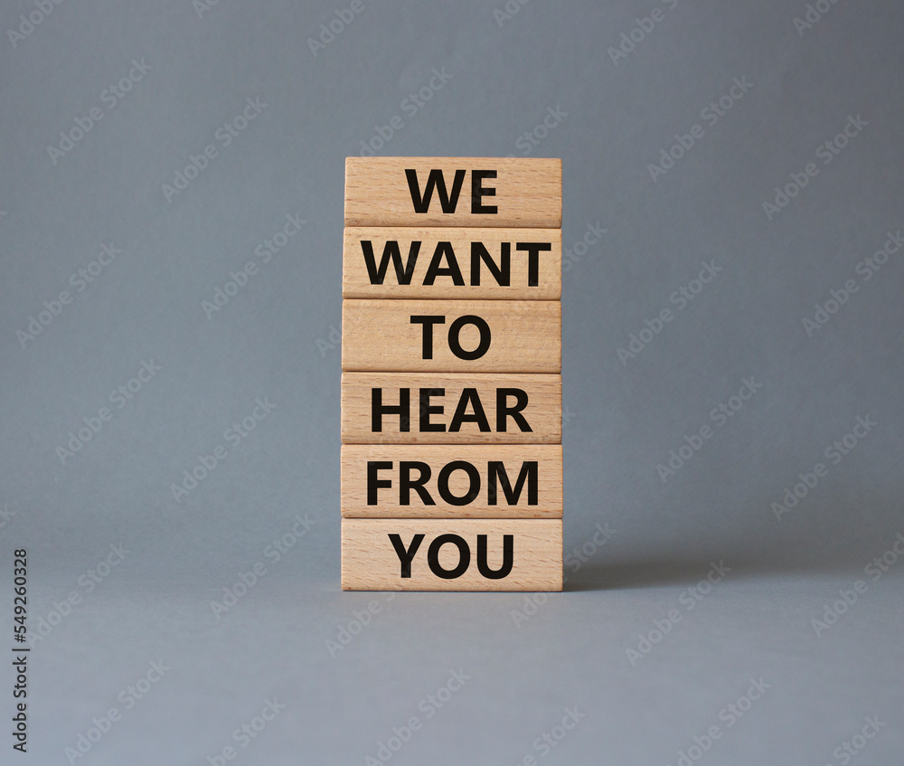 We want to hear from you symbol. Wooden blocks with words We want to hear from you. Beautiful grey background. Business and We want to hear from you. Copy space. We want to hear from you symbol. Wooden blocks with words We want to hear from you. Beautiful grey background. Business and We want to hear from you. Copy space.
