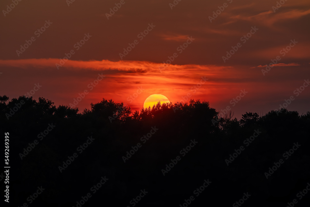 Sun close-up through telephoto lens at sunset