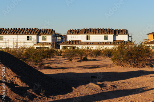 The construction site of two-story homes is visible from the vacant land, where a pile of dirt sits © Eduardo Barraza