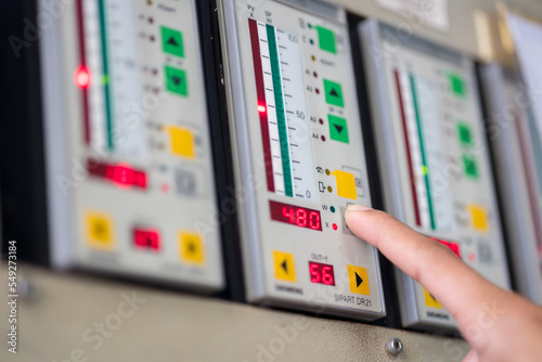 Valokuva Finger pressing button Variable speed drive conrtoller used in factories