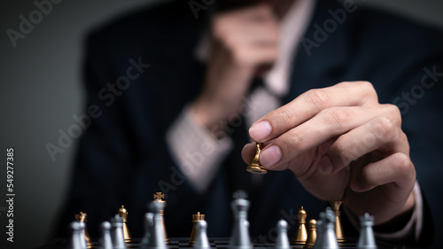 Businessman playing chess think problem solving. business competition planning teamwork,International chess, ideas and competition and strategy, business success concept,strategic concept.
