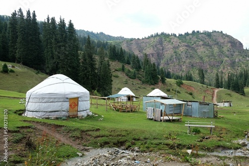 Yurt camp in Karakol Mountains, Tien Shan Mountains, Kyrgyzstan, Central Asia. Traditional nomad's yurts on green mountain meadow in summer.  © Iwona