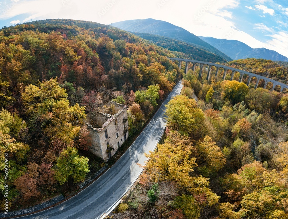 Saggittario bridge aerial view into autumn woods
