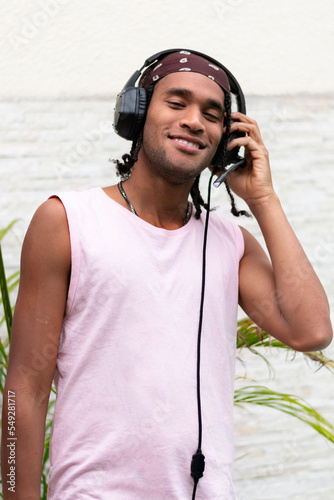 Portrait young afro american man have fun listening to music. Portrait Photo