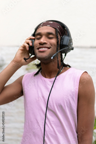 Portrait young afro american man have fun listening to music. Portrait Photo