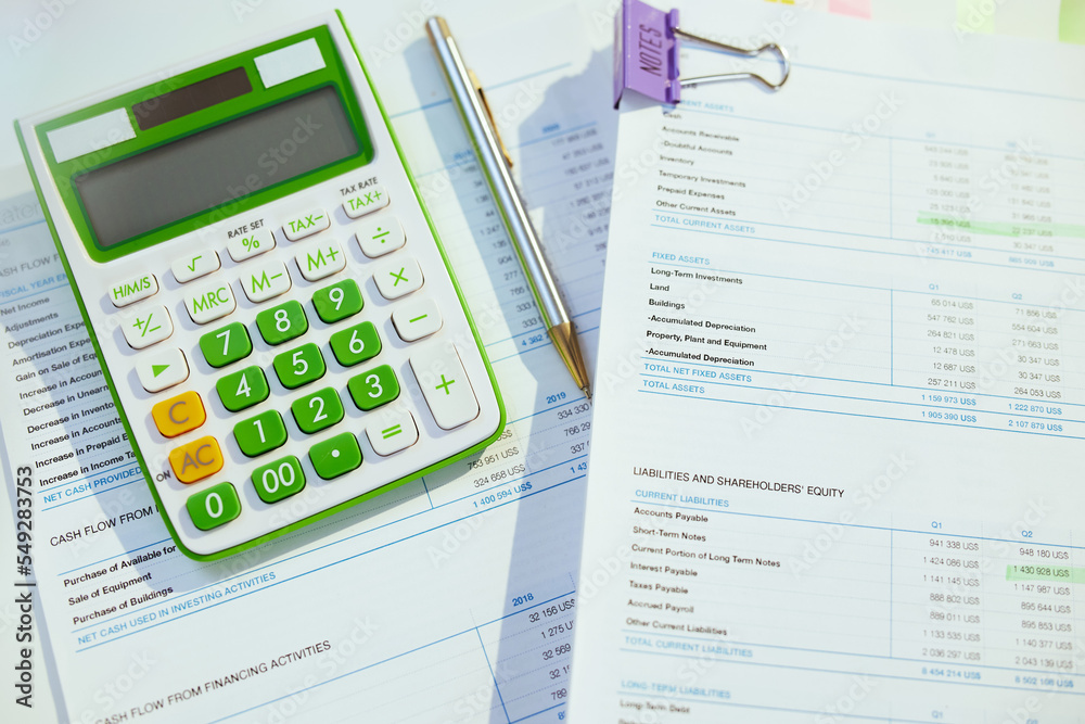 tax time. calculator and documents on desk tax time. calculator and documents on desk