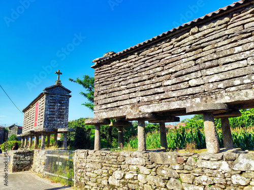 Dry-stone granaries in Olveiroa village, Dumbria municipality, Galicia, Spain photo