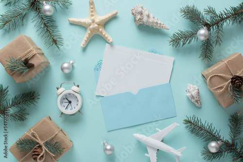 cards, an airplane, and fir branches with Christmas decorations and gifts in eco-packaging.