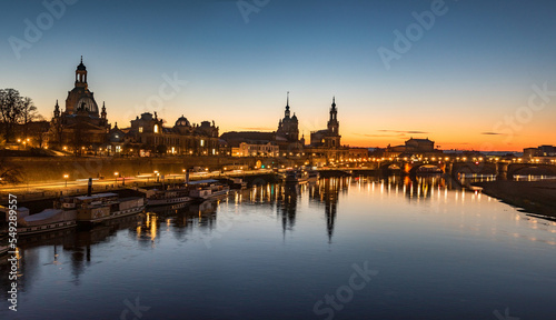  Dresden city skyline at Elbe river and Augustus Bridge at sunset , Dresden, Saxony, Germany. Panoramic evening view of Dresden.