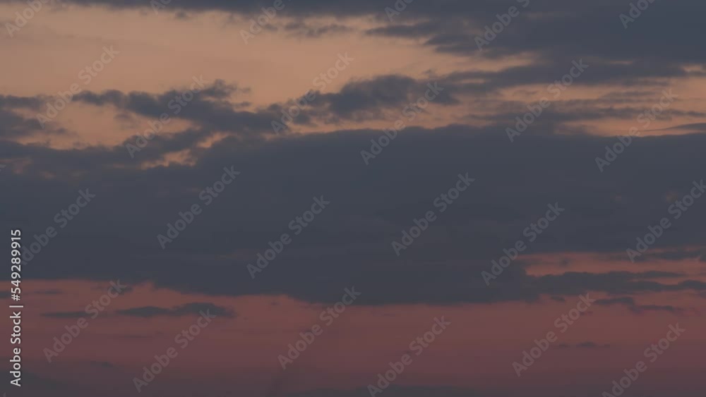 Dark clouds float over the city. Night falls, timelapse. City infrastructure Dark clouds float over the city. Night falls, timelapse. City infrastructure