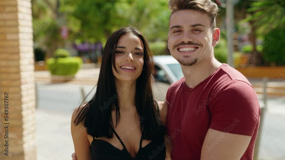 Man and woman couple smiling confident hugging each other at street Man and woman couple smiling confident hugging each other at street