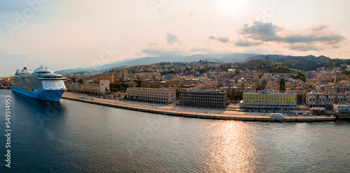 Messina, Sicily, Italy, August 20, 2022. View of the Messina's port with the gold Madonna della Lettera statue © Aerial Film Studio