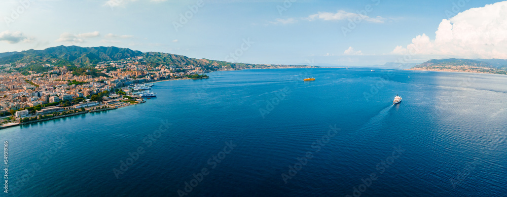 Messina, Sicily, Italy, August 20, 2022. View of the Messina's port with the gold Madonna della Lettera statue