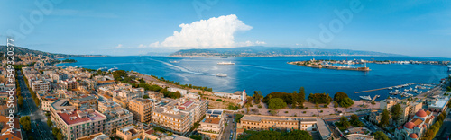 Messina, Sicily, Italy, August 20, 2022. View of the Messina's port with the gold Madonna della Lettera statue photo