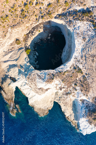 View of the volcanic open cave of Sykia, Milos island, Cyclades, Greece photo
