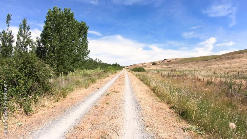 Camino de Madrid - Camino Natural Via Verde del Valle del Eresma - dual track gravel road after Los Huertos, province of Segovia, Castile and León, Spain Camino de Madrid - Camino Natural Via Verde del Valle del Eresma - dual track gravel road after Los Huertos, province of Segovia, Castile and León, Spain