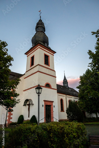 Krperich, church (die katholische Pfarrkirche Sankt Hubertus) in the street photo
