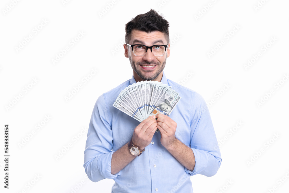 Happy man holding paper money studio. Rich man smiling with money banknotes. Making money Happy man holding paper money studio. Rich man smiling with money banknotes. Making money