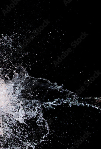 Shape form droplet of Water splashes into drop water attack fluttering in air and stop motion freeze shot. Splash Water for texture graphic resource elements, black background isolated