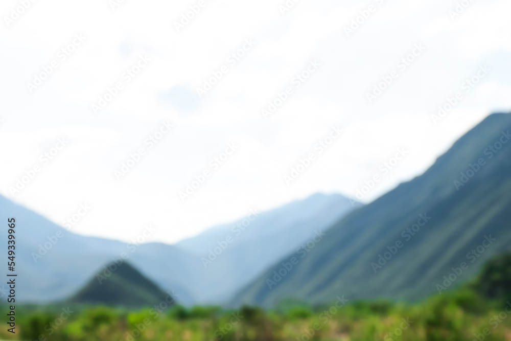 Obraz premium Blurred view of high mountains under sky outdoors