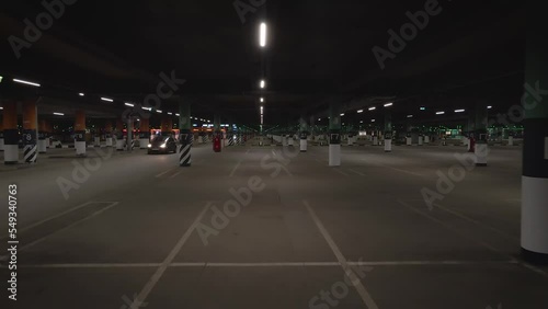View from drone of the underground parking shopping mall with LED pink lamp in night summer day