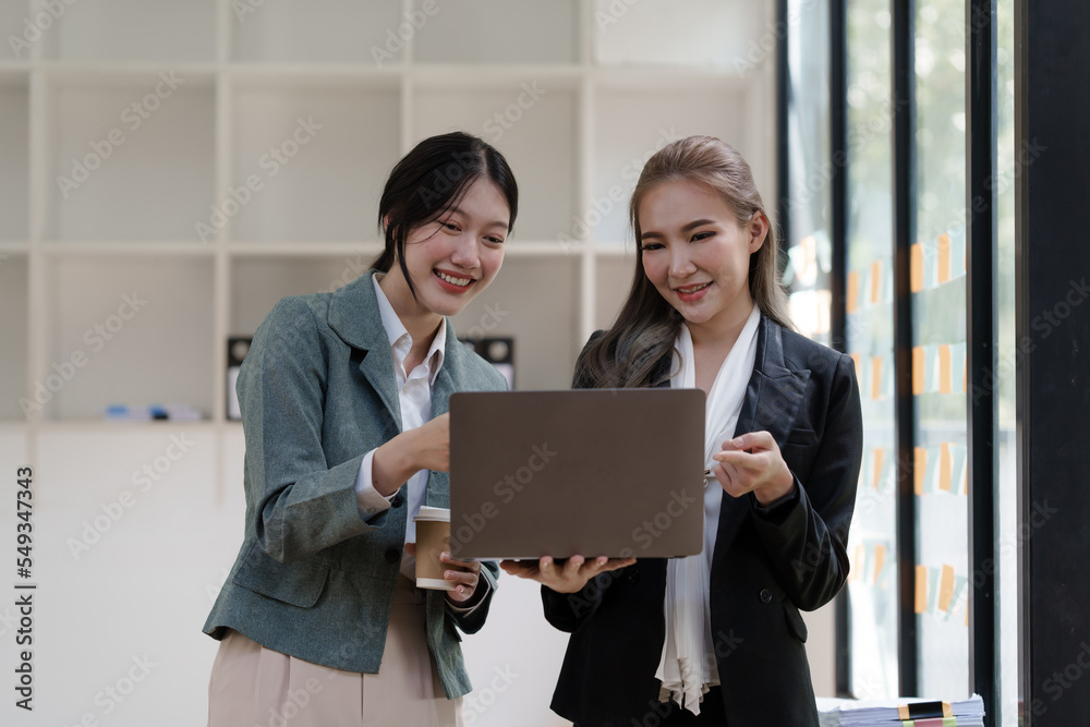 Female office worker business suit working together with friends in office, successful and agreement concept Female office worker business suit working together with friends in office, successful and agreement concept