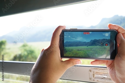 Photos of people using their phones to record video.
