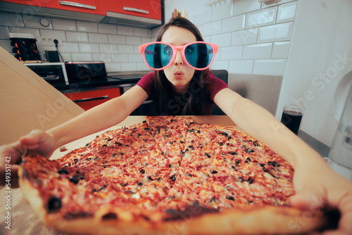 Slika na platnu Funny Woman Celebrating Alone Eating a Giant Pizza
