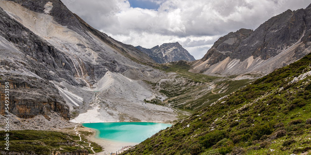 Panoramic view on the Milk lake at Doacheng Yading National park, Sichuan, China. Last Shangri-la hight 4,600 meter from sea level. It’s beautiful place field, Snow mountain, lake