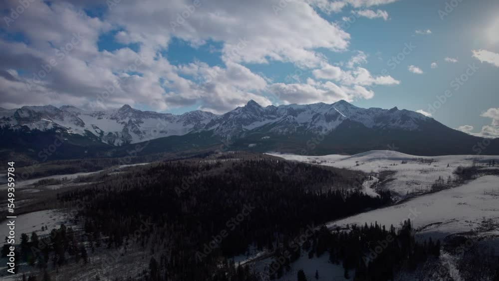 Snow covered rugged
mountains with blue sky and clouds near Telluride Colorado Snow covered rugged
mountains with blue sky and clouds near Telluride Colorado
