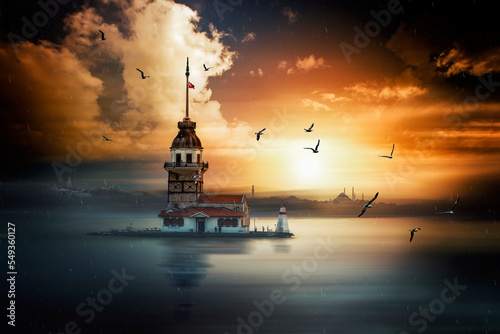 Beautiful landscape of Maiden Tower, sea gulls, sunset, clouds and bosphorus of Istanbul in Turkey.