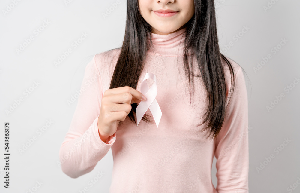 woman hands holding pink ribbon, Breast cancer awareness, world cancer day, national cancer survivor day in february concept... woman hands holding pink ribbon, Breast cancer awareness, world cancer day, national cancer survivor day in february concept...