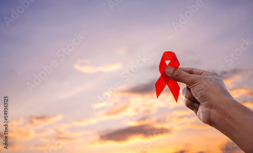 Red Ribbon for December World Aids Day, multiple myeloma Cancer Awareness month and National Red ribbon week. HIV AIDS awareness red ribbon World aids day, World cancer day concept photo