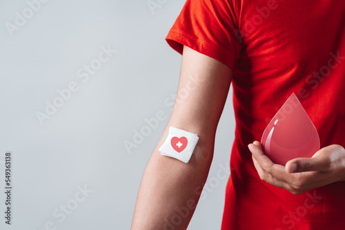 man hands holding donation blood paper cut, blood transfusion, world blood donor day, world hemophilia day concept.